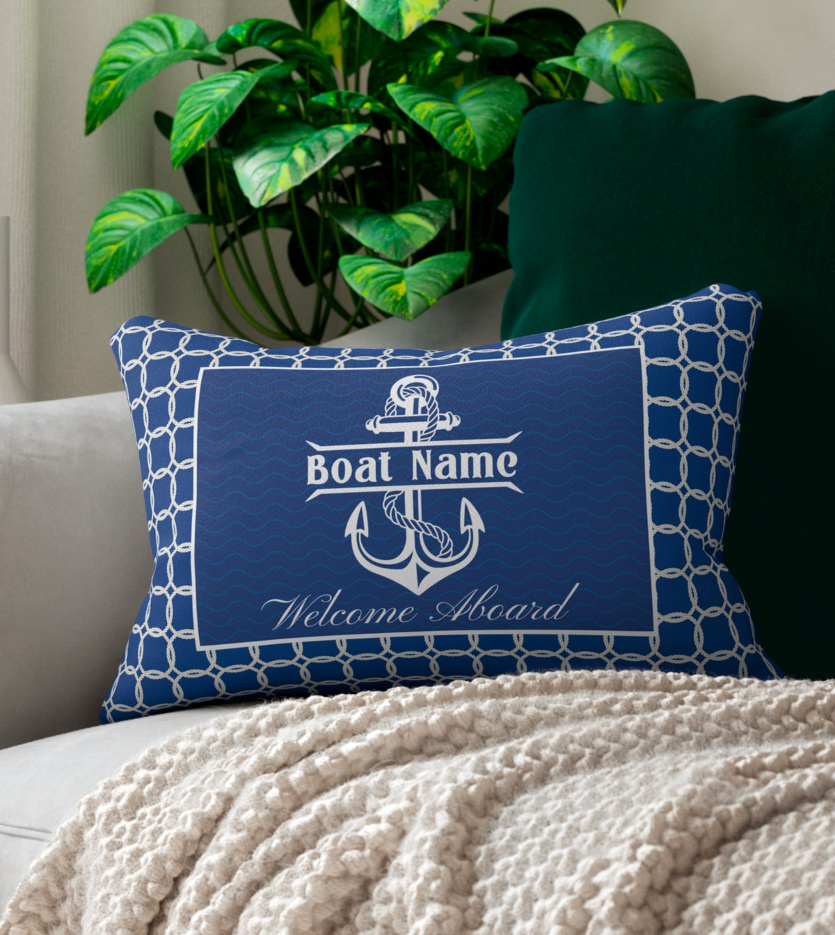 A rectangular lumbar pillow with a nautical theme, personalized with a custom boat name. The pillow features a navy blue background with a white anchor and rope design. The boat name is printed in bold white letters at the center. This comfortable maritime decor item, perfect for yacht, boat, pontoon, ship, or cruise owners, is available in a variety of nautical patterns and is sold by StarryPrints