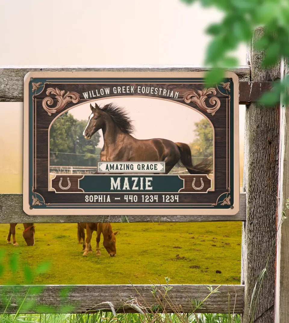 A custom metal equestrian sign suspended by twine against a wooden wall, featuring an image of a galloping horse with customizable horse name and ranch name. customizable Contact details are included below the horse's image. The sign displays a classic design with ornamental corners and horse motifs, suggesting a personalized piece for horse owners or stable decoration