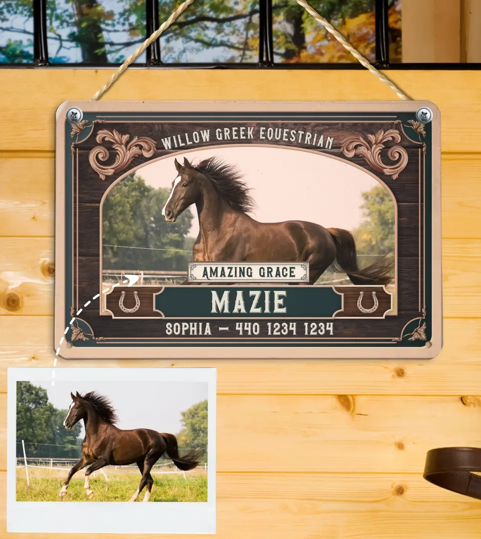 A custom metal equestrian sign suspended by twine against a wooden wall, featuring an image of a galloping horse with customizable horse name and ranch name. customizable Contact details are included below the horse's image. The sign displays a classic design with ornamental corners and horse motifs, suggesting a personalized piece for horse owners or stable decoration