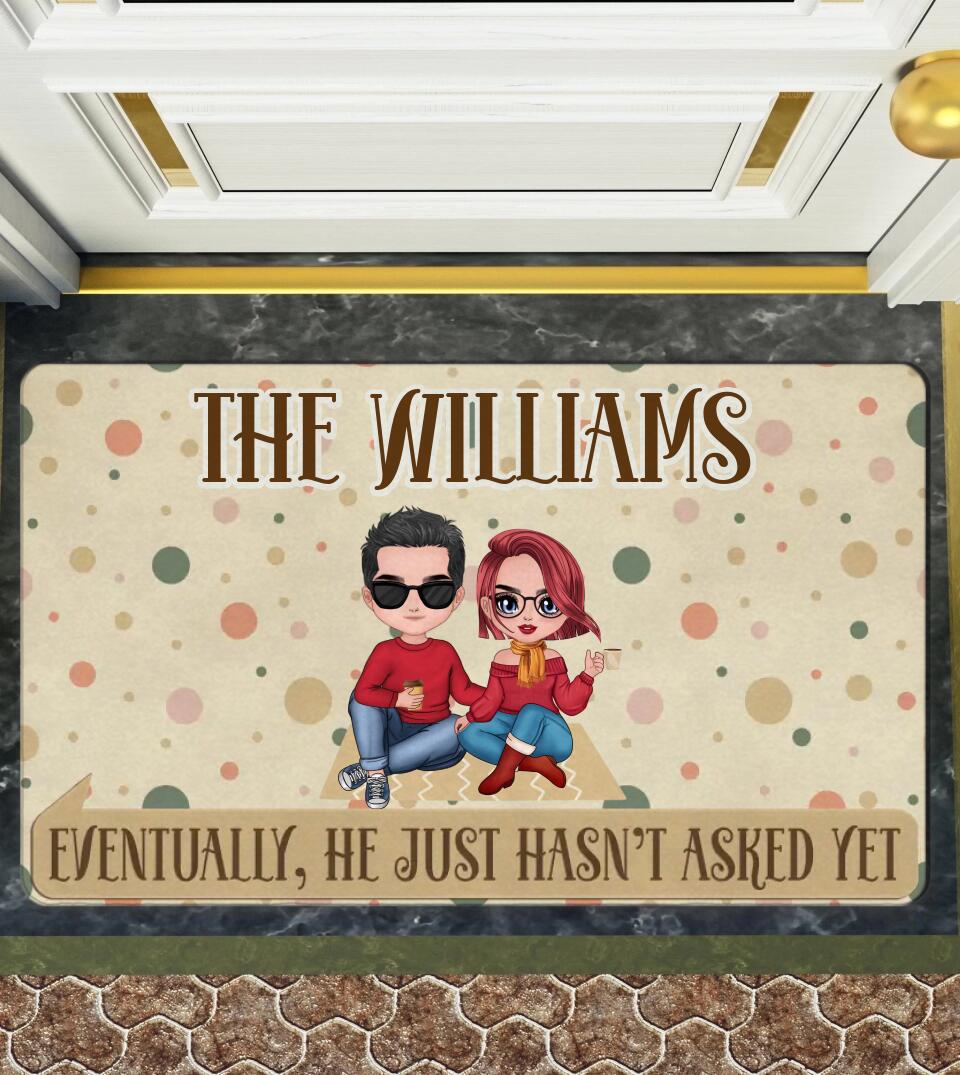 A personalized doormat with the quote "Eventually, He Just Hasn't Asked Yet" featuring a cute pet design. A fun and playful way to hint at your significant other to pop the question. Made with high-quality materials and non-slip rubber backing. A perfect addition to any home decor, and great for engagement or wedding photos.