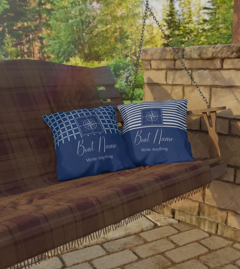 Personalized Water-Resistant Outdoor Pillow with Custom Boat Name displayed on a wooden deck. This square pillow, perfect for yacht, boat, pontoon, ship, or cruise owners, features a water-resistant material and a nautical design with an anchor and a compass. The pillow is customized with a boat name, making it a unique and personal accessory for maritime enthusiasts. Ideal for boat parties, summer outings, or as a unique gift for boat owners and sailing enthusiasts.
