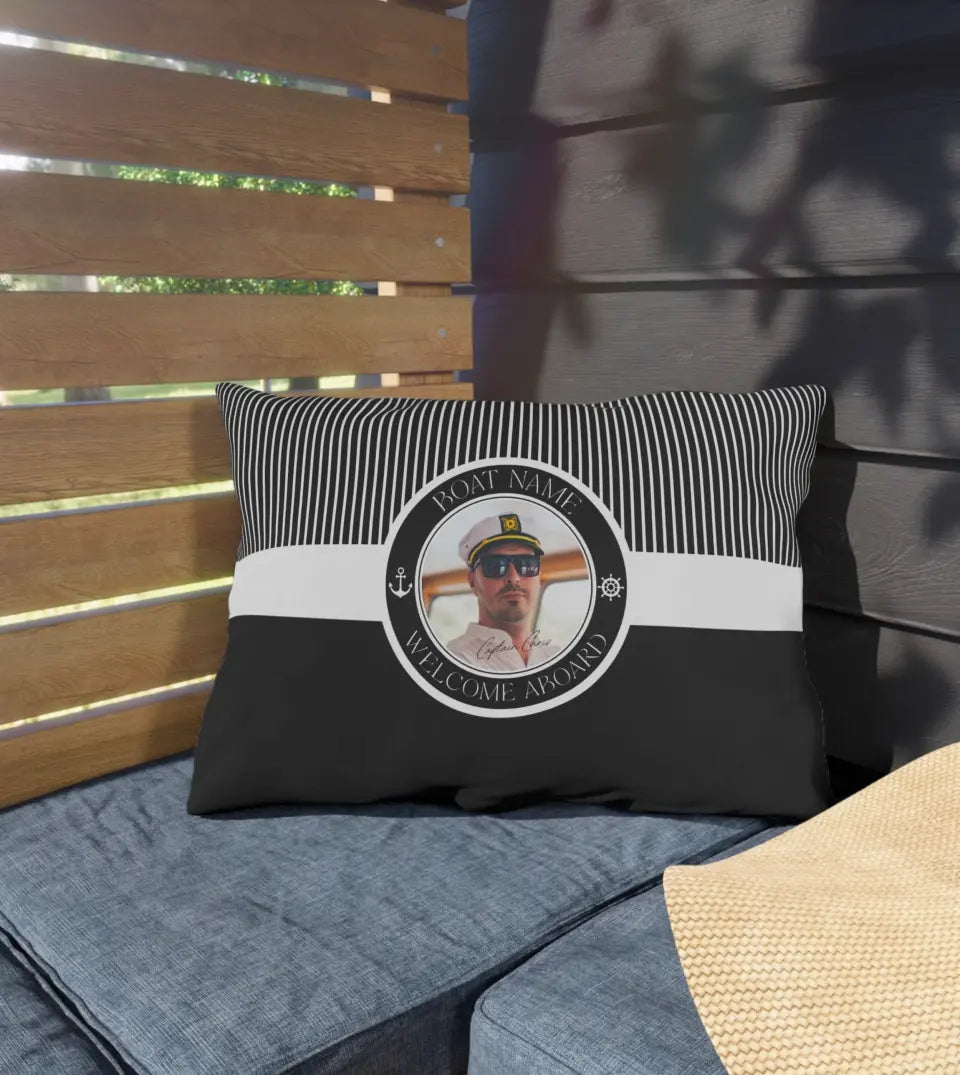 Personalized Water-Resistant Lumbar Boat Pillow with Custom Captain Photo and Boat Name displayed on a wooden deck. This lumbar pillow, perfect for yacht, boat, pontoon, ship, or cruise owners, features a water-resistant material and a nautical design with a custom photo in the center. The pillow is customized with a boat name, making it a unique and personal accessory for maritime enthusiasts.