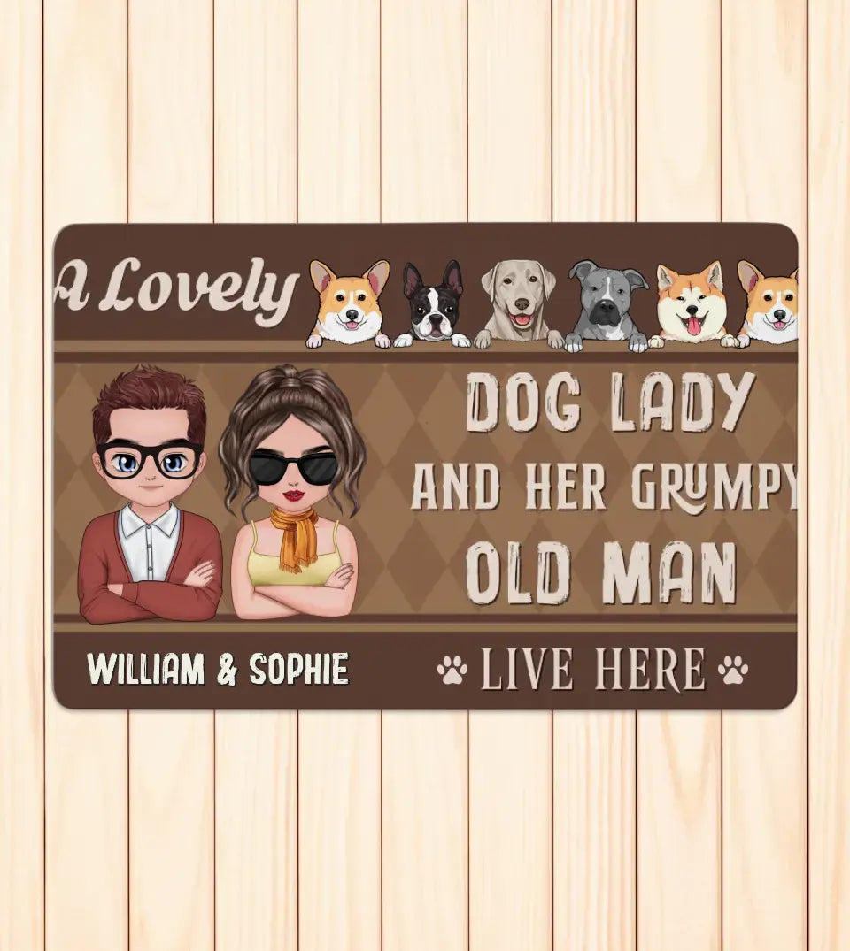 A unique, personalized doormat featuring a dog's paw print and the playful quote 'A Lovely Dog Lady and Her Grumpy Old Man Live Here'. This doormat is perfect for dog lovers and couples, making a warm and welcoming statement at the entrance of a home. It's a unique gift for pet lovers and a great way to celebrate your furry friend