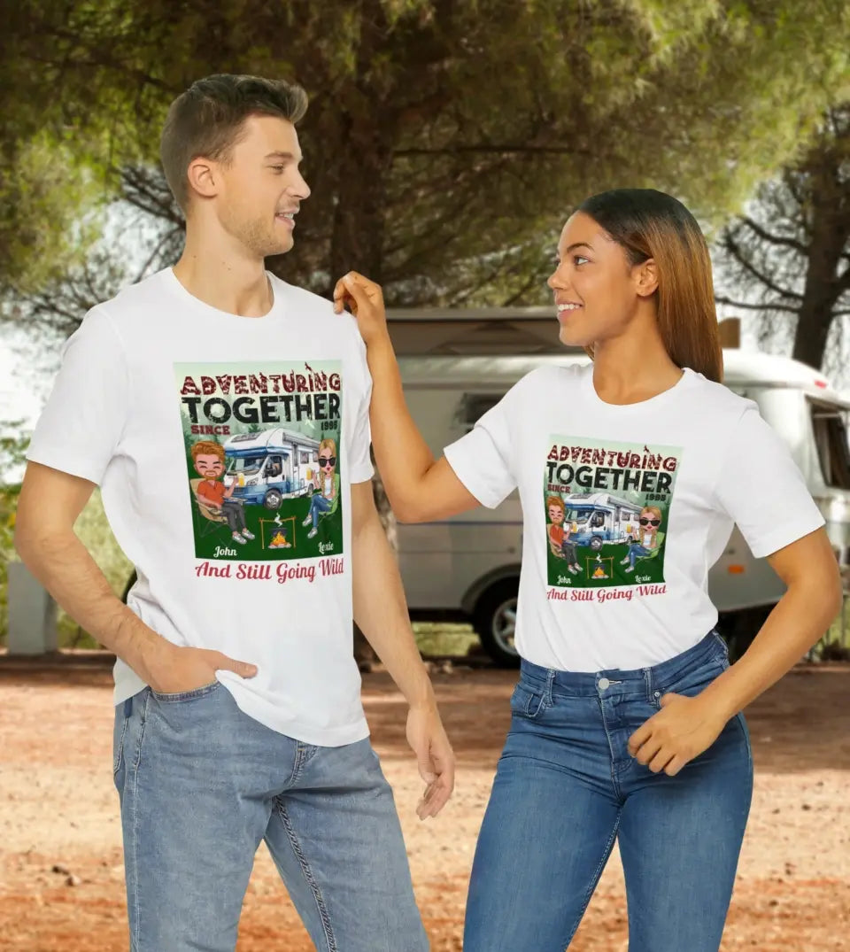 A personalized camping couple t-shirt/sweatshirt from StarryPrints. The design features two chibi characters adventuring together in a camping setting. This unique and custom piece is perfect for couples who love camping and outdoor adventures.