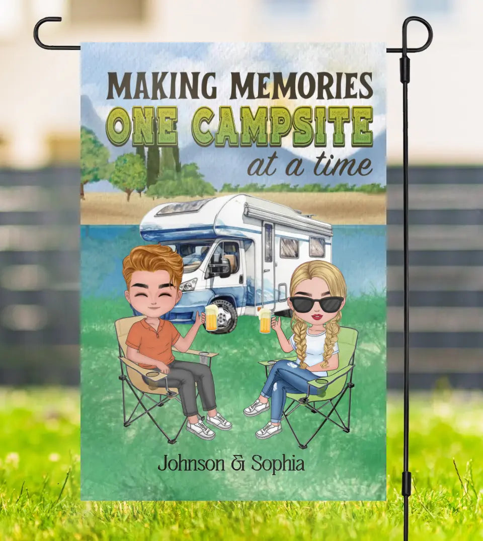 Personalized garden flag featuring a camping couple with their pets and the quote 'Making Memories One Campsite At A Time'. Customizable with names for camping enthusiasts and pet lovers