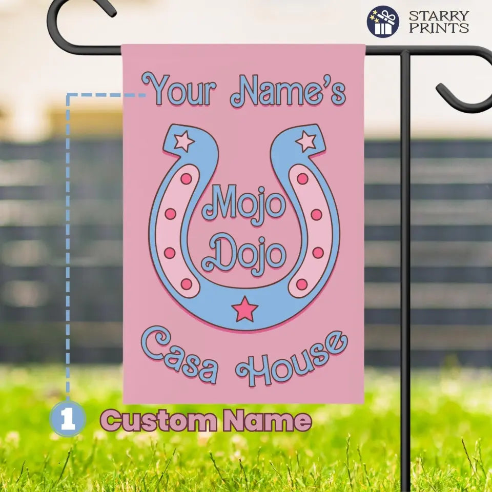 Pastel pink personalized garden flag with horseshoe design, featuring 'Mojo Dojo Casa' text and space for custom name. Barbiecore aesthetic with playful and colorful elements, symbolizing luck and individuality