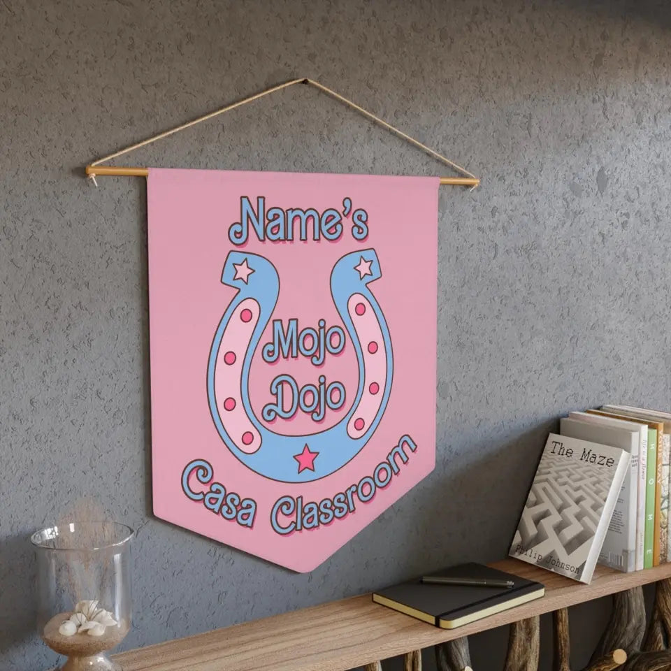 Pastel pink classroom pennant featuring 'Mojo Dojo Casa' text, personalized with a teacher's name, adorned with stars and a horseshoe design, reflecting a Barbiecore aesthetic.