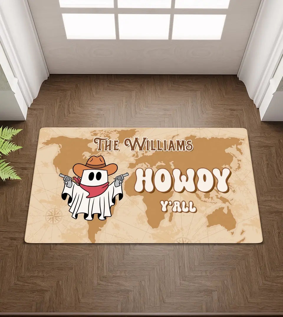 A playful and unique doormat features a ghostly cowboy figure. Above the cowboy ghost, there's a customizable space for a family name, making it a personal touch to any home. The design combines Halloween, cowboy, and cute themes, making it a perfect fall decor piece.