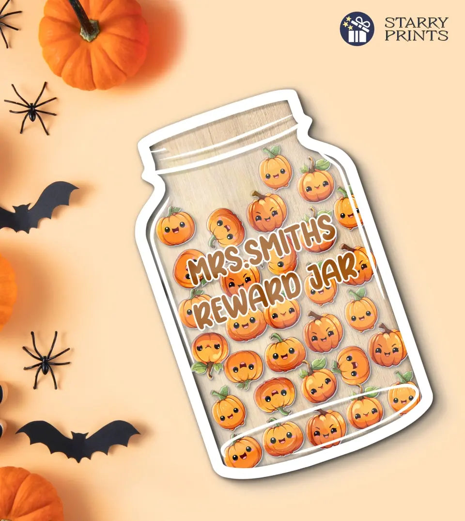 A clear acrylic reward jar filled with pumpkin-shaped tokens, set against a white background. The jar showcases a customizable design with a twine jute for hanging, emphasizing its use as an educational tool for tracking goals and rewarding achievements.