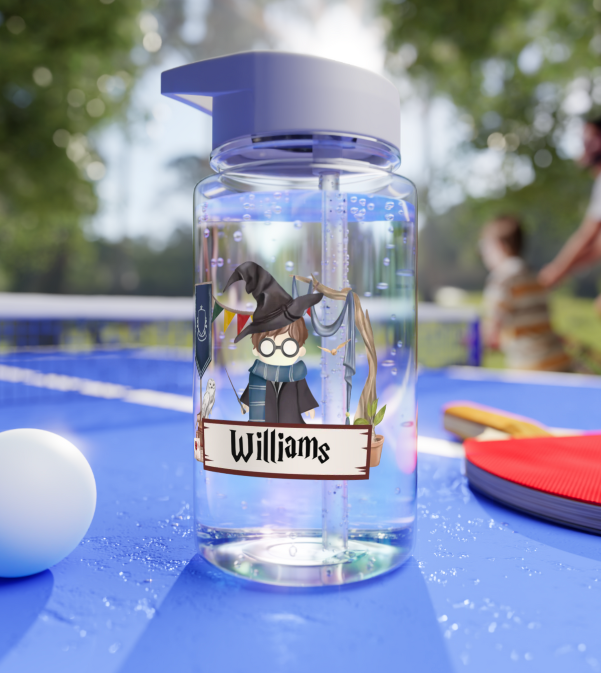 A customized water bottle for kids with a wizard design, featuring a personalized wizard doll with a chosen house color and name.This BPA-free water bottle for kids features a fun wizard design, with a personalized wizard doll, chosen house color, and custom name.